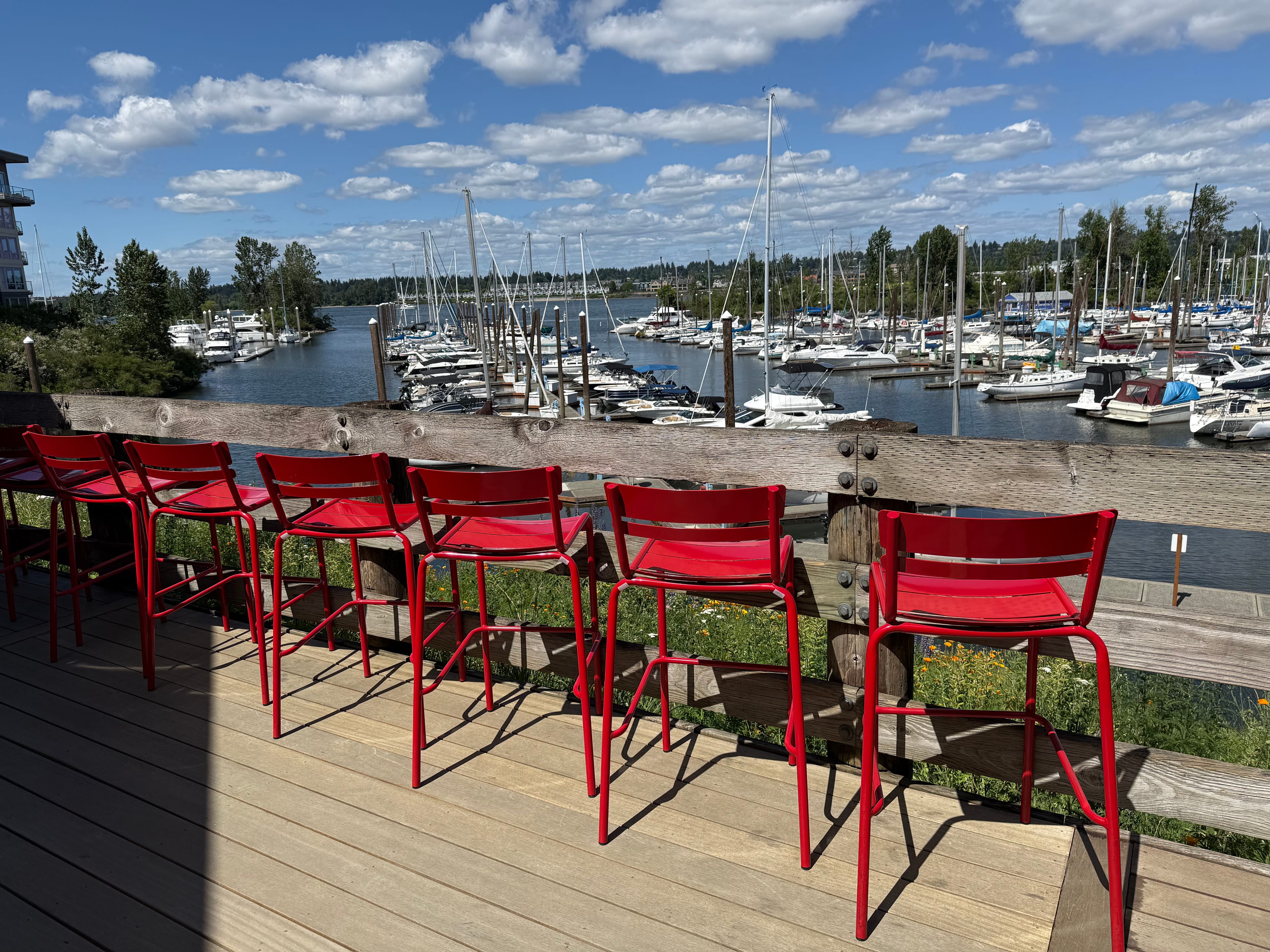 Barstools on the deck at Pal's overlooking Tomahawk Bay near Downtown Portland and Downtown Vancouver